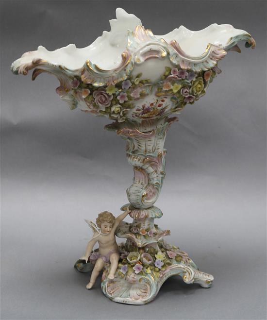 A floral and putti encrusted centrepiece height 35cm